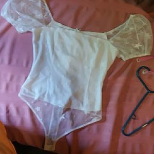 Le Lis small white stars bodysuit with puffy sleeves off shoulder.